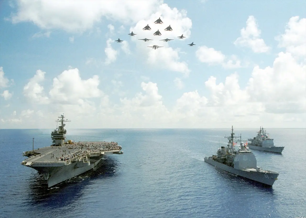 Carrier Air Wing Seven (CVW-7) performed a fly-over in formation along with John F. Kennedy 
(CV-67), Hue City (CG-66), Vicksburg (CG-69) and The Sullivans (DDG-68) to conclude an air show 
performance 16 August 2002.